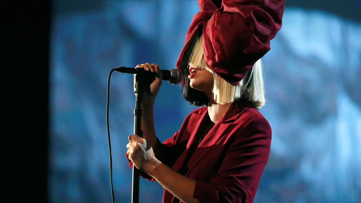 Sia performing at a concert venue