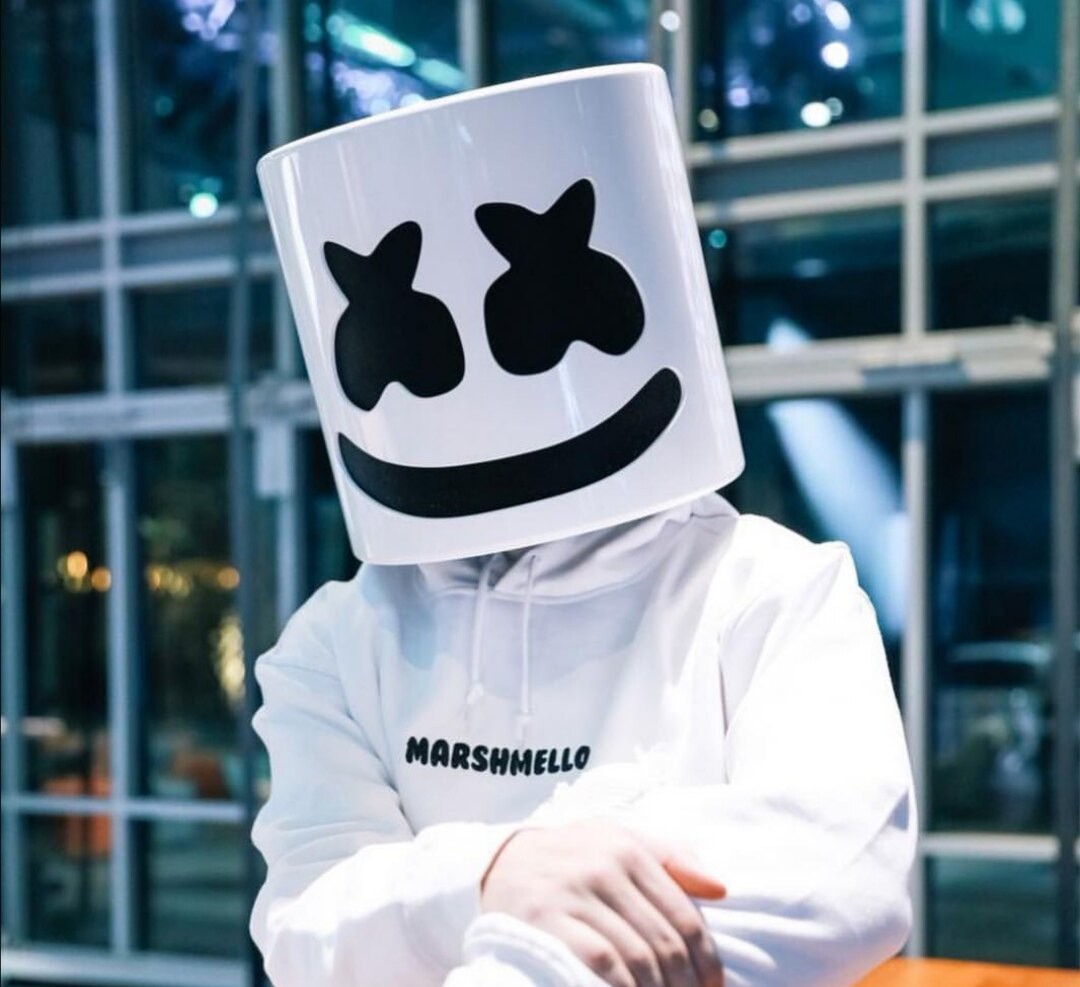 Marshmello performing with white helmet